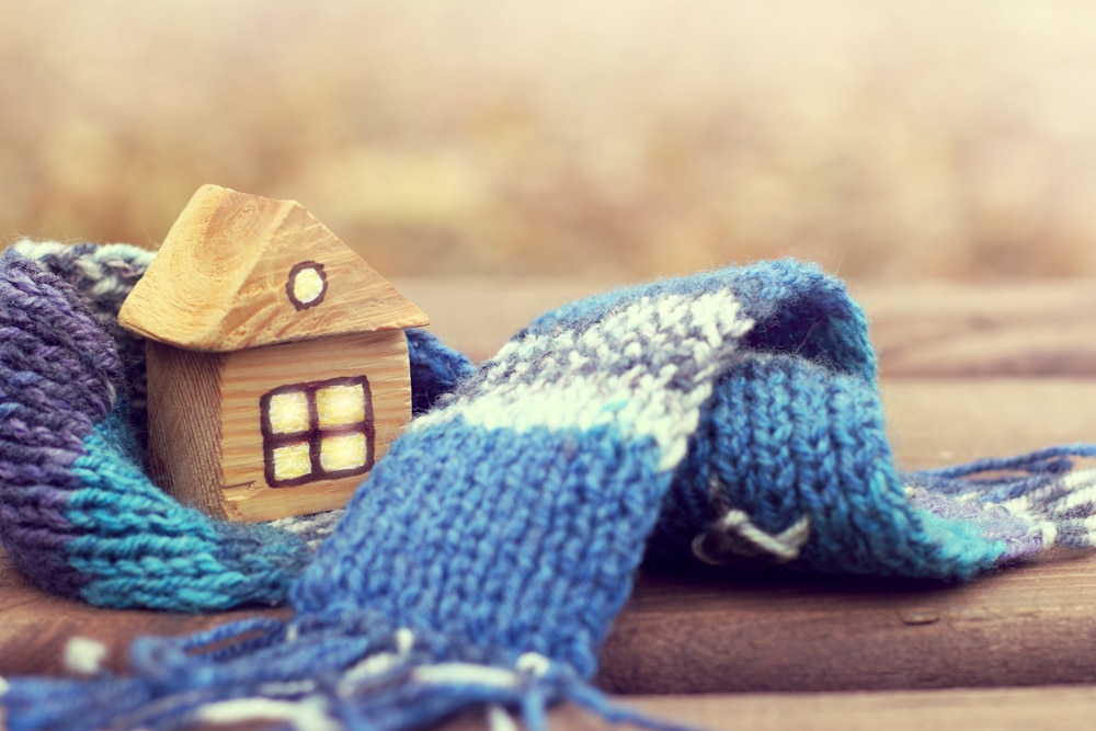 Tiny house wrapped in knit scarf