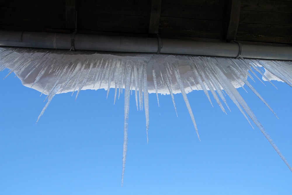 Icicles hanging off edge of roof