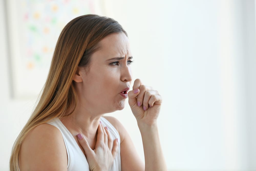 Woman coughing