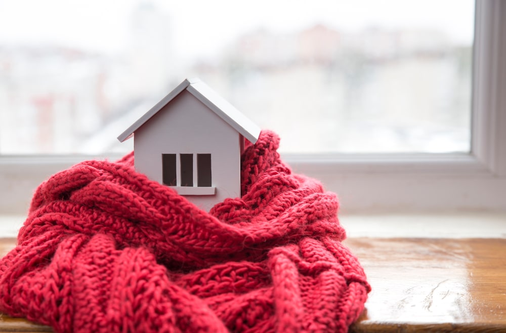 Tiny house wrapped in knit scarf