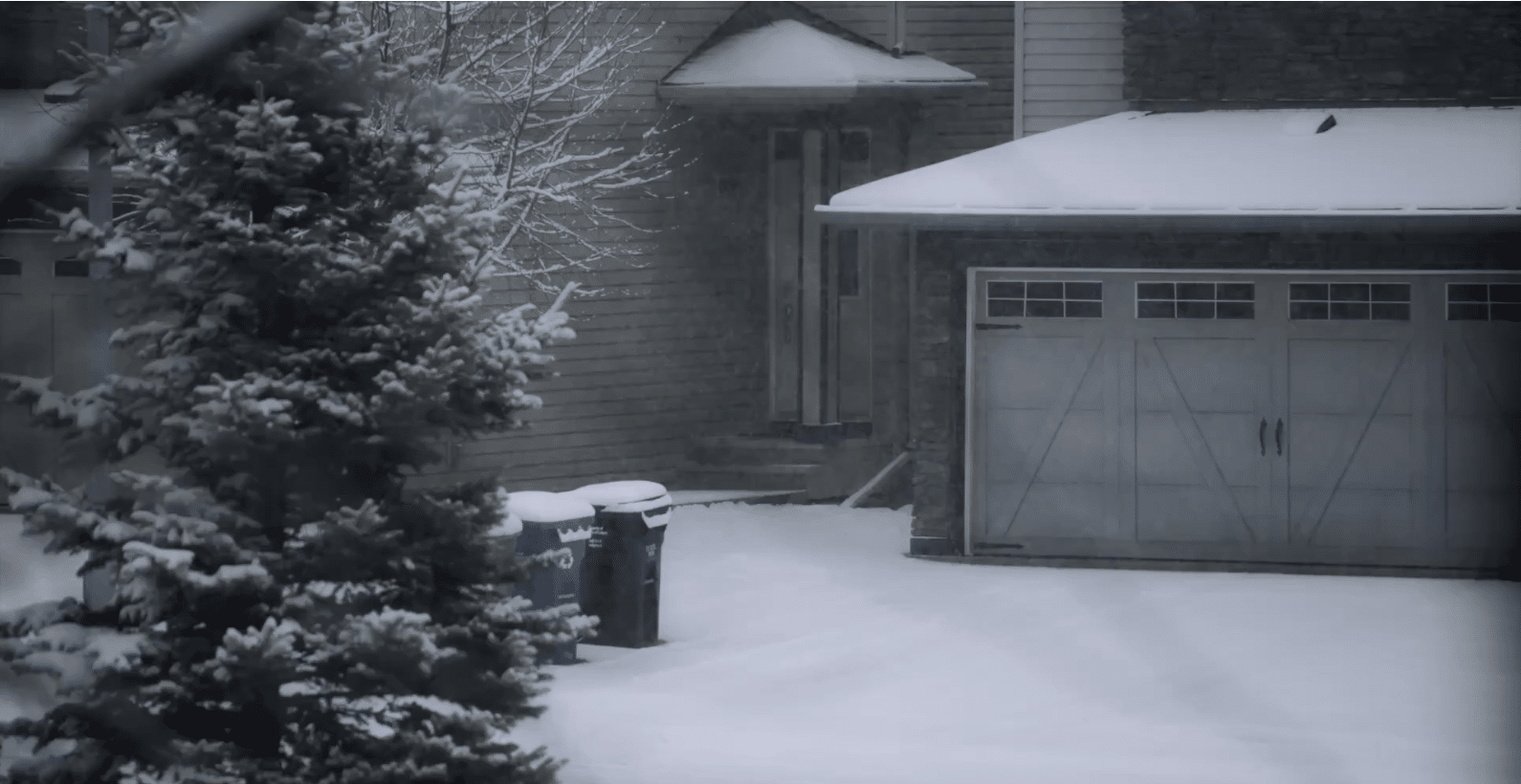 snowy house and garage